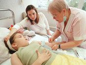 Picture of young girl in hospital bed